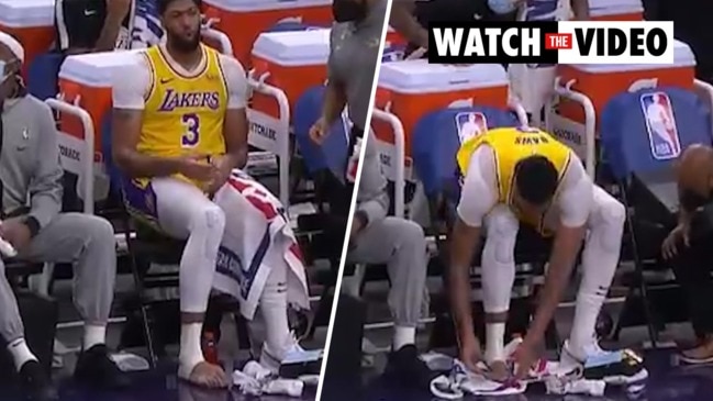 NBA: Anthony Davis clips his toe nails on court