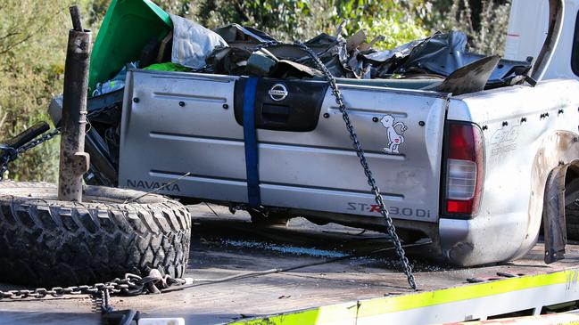 SYDNEY, AUSTRALIA - NEWSWIRE Photos - September 07, 2022: A tow truck driver is seen removing the remains of the car at the crash site where 5 young teenagers were tragically killed in an accident last night at 8pm in Buxton, in Sydney. Picture: NCA Newswire