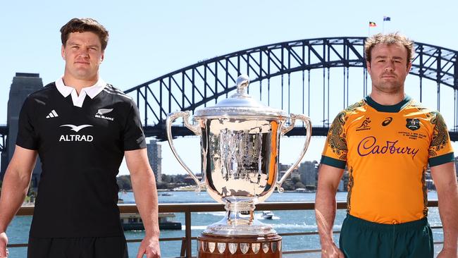 SYDNEY, AUSTRALIA - SEPTEMBER 20: All Blacks captain Scott Barrett and Wallabies captain Harry Wilson pose alongside the Bledisloe Cup during a media opportunity ahead of tomorrow night's Wallabies v All Black Bledisloe Cup match, at Sydney Opera House on September 20, 2024 in Sydney, Australia. (Photo by Jason McCawley/Getty Images)