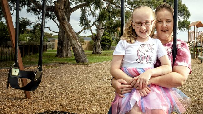 Emma McKenzie with daughter Ruby, 7, at a park near their home. Picture: Luis Enrique Ascui