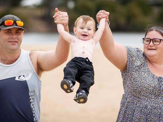 Hunter at Thompsons Beach with his parents Lisa and Marty. Picture: Mark Stewart