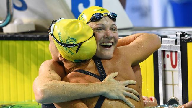 Cate Campbell embraces teammate Holly Barratt after victory.