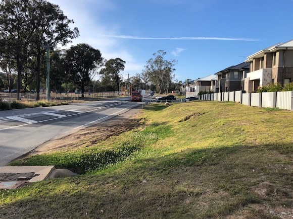 Green space out the front of properties along Denham Court Rd, Leppington in 2019.