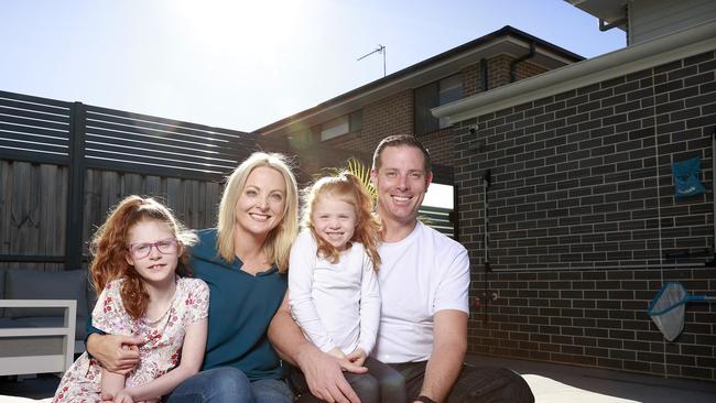 NETWORK. MAY 20, 2023. Pictured at home in Box Hill today is Michael Desmyth with wife Jordana, and their daughters Skylar 8 and Indiana 5, for a story on Solar power. Picture: Tim Hunter.