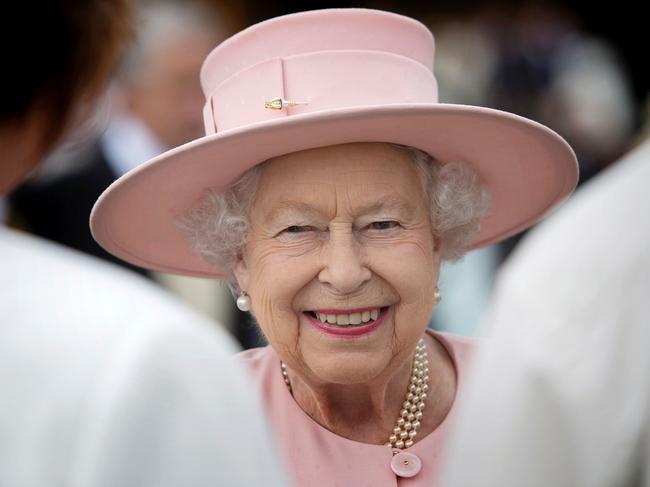 Britain’s Queen Elizabeth II greets guests at a garden party at Buckingham Palace in London on May 16, 2017. Picture: AFP