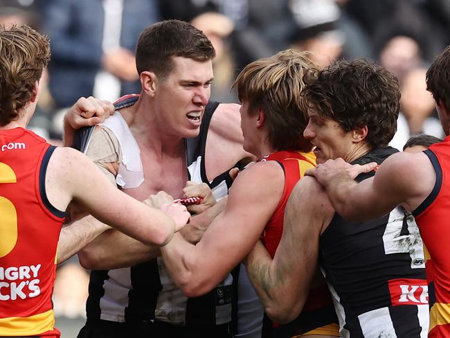 MELBOURNE - June 25 : AFL.   Mason Cox of the Magpies runs at Josh Worrell of the Crows after kicking a goal in the 4th qtr starting a melee  during the round 15  AFL match between Collingwood and Adelaide at the MCG on June 25, 2023, in Melbourne.  Photo by Michael Klein.