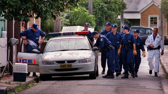 Police outside house the home on Doran Street at Carrington the day after the bodies of Susan Kay and Joanne Teterin were discovered on May 17, 2000. A coroner would later rule they were murdered on May 11, 2000. Picture: Robert McKell.