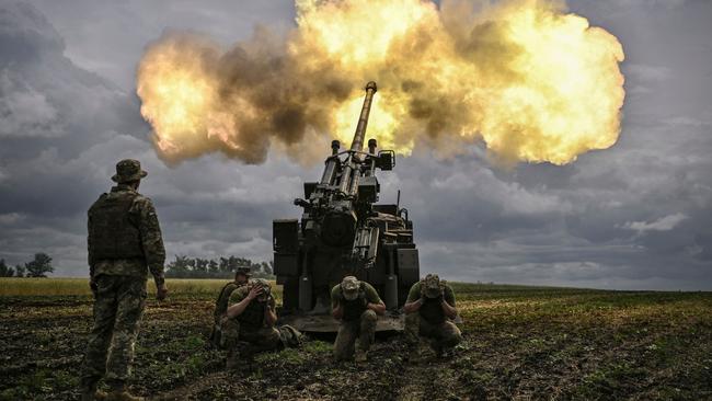 Ukrainian servicemen fire with a French self-propelled 155mm/52-calibre gun Caesar towards Russian positions at a front line in the eastern Ukrainian region of Donbas on June 15 — the day Ukraine pleaded with Western governments to decide quickly on sending heavy weapons to shore up its faltering defences. Picture: Aris Messinis/AFP