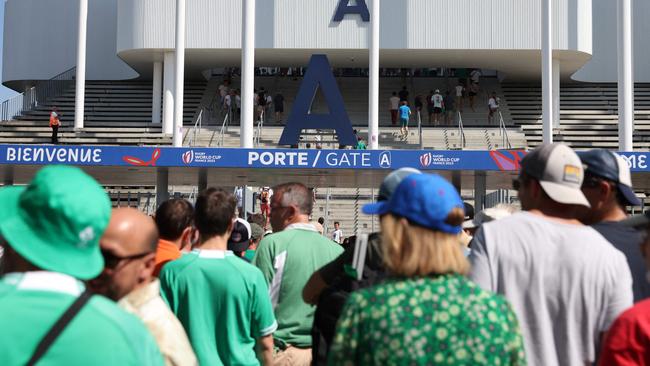 Ireland's supporters queue to enter the stadium ahead of the France 2023 Rugby World Cup Pool B match between Ireland and Romania at Stade de Bordeaux in Bordeaux, south-western France on September 9, 2023. (Photo by ROMAIN PERROCHEAU / AFP)