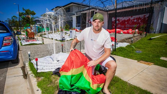 Coomera resident Hayden Annand with one of his deflated toy soldiers. Photo: Nigel Hallett.