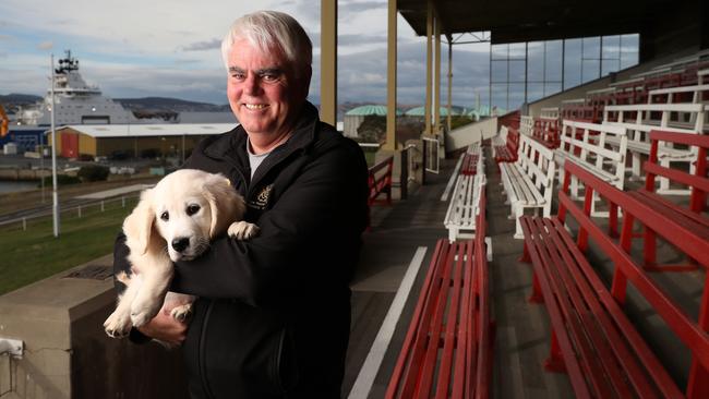 Scott Gadd Royal Agricultural Society of Tasmania president with puppy Wilby at the Hobart Regatta Grounds. The Royal Hobart Show will move to the Hobart Regatta Grounds while the Glenorchy site is redeveloped over several years. Picture: Nikki Davis-Jones