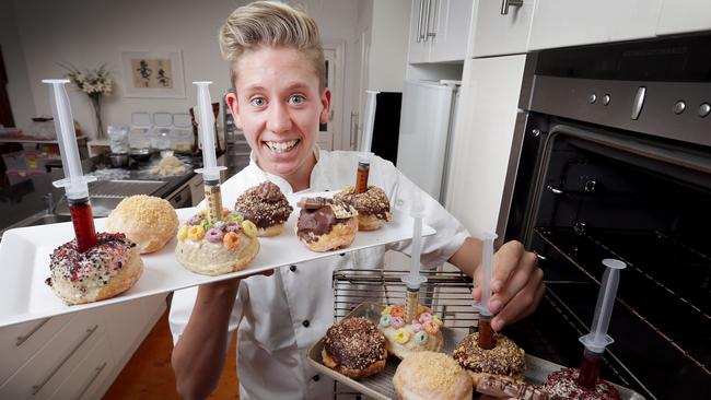 Year 10 student Morgan Hipworth at home in the kitchen where he prepares his Bistro Morgan gourmet doughnuts which he supplies to about 12 cafes. Picture: Nicole Cleary