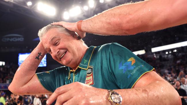 MELBOURNE, AUSTRALIA - MARCH 31: Scott Roth, coach of the JackJumpers reacts after having a powerade bucket poured after winning game five of the NBL Championship Grand Final Series between Melbourne United and Tasmania JackJumpers at John Cain Arena, on March 31, 2024, in Melbourne, Australia. (Photo by Kelly Defina/Getty Images)