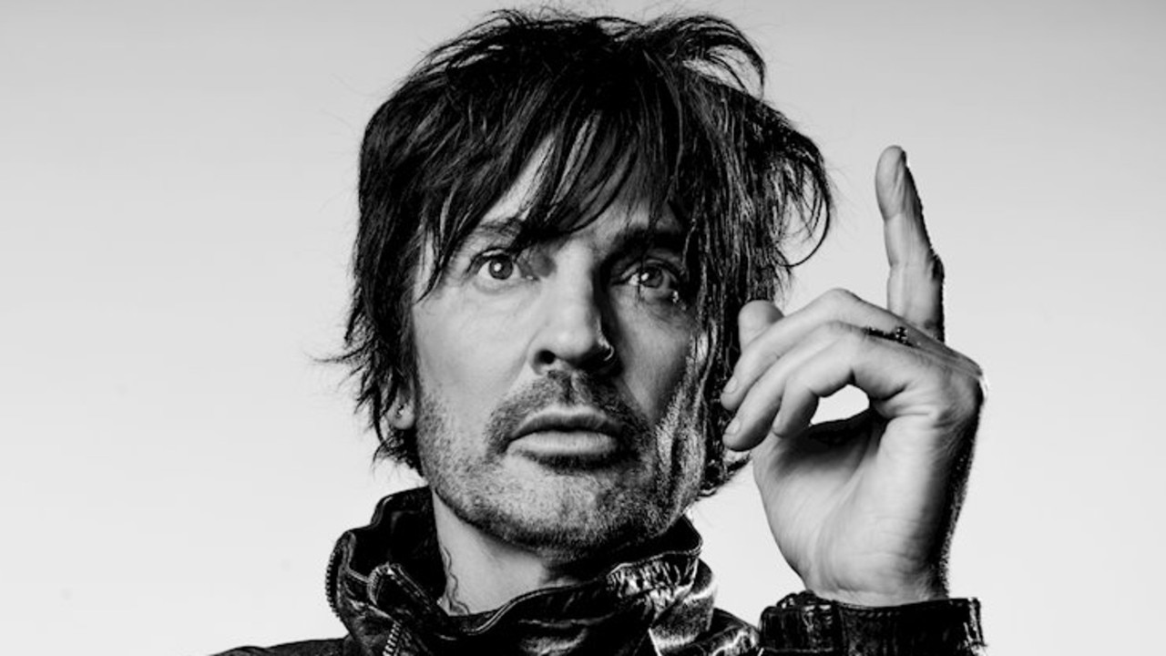 Tommy Lee licked Jackie O’s face and neck while doing a radio interview. Picture: Supplied