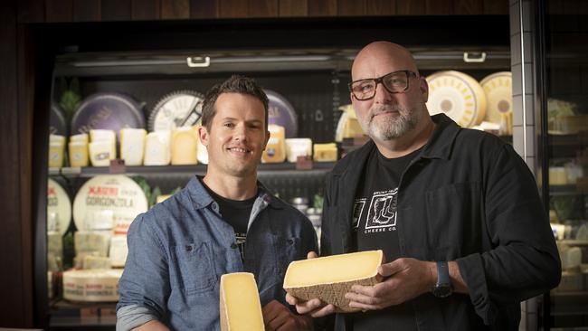 Bruny Island Cheese Company, head cheese maker Luke Jackson and founder Nick Haddow with their award winning Raw Milk C2 Cheese at Hill Street Grocer, Sandy Bay. Picture: Chris Kidd