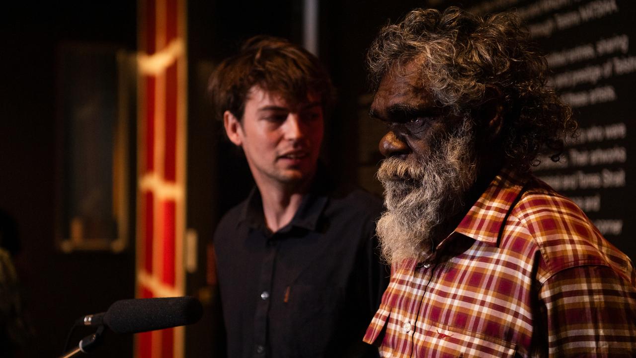 Telstra National Aboriginal and Torres Strait Islander Art Awards winner Noli Rictor, a Pitjantjatjara man, with his translator Riley Adams Brown, in front of Mr Rictor's artwork Kamanti at the Museum and Art Gallery of the Northern Territory (MAGNT), on Larrakia Country, Darwin. Picture: Pema Tamang Pakhrin