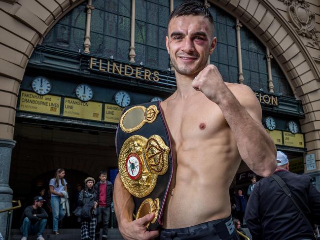 Australian boxer Andrew Moloney with his world champion belt. Picture: Jake Nowakowski