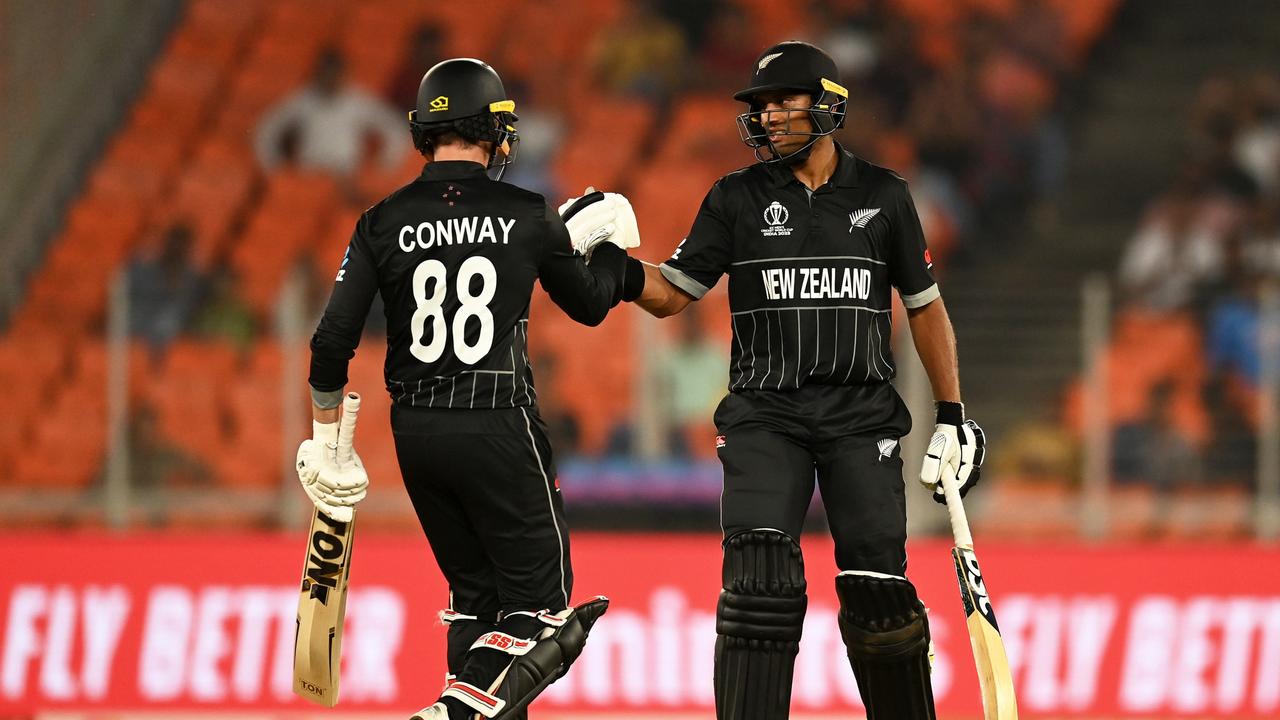 Devon Conway and Rachin Ravindra of New Zealand with empty seats behind them. Photo by Gareth Copley/Getty Images)