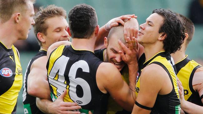 Kamdyn McIntosh is swamped by the Tigers after kicking a goal. Picture: Getty Images