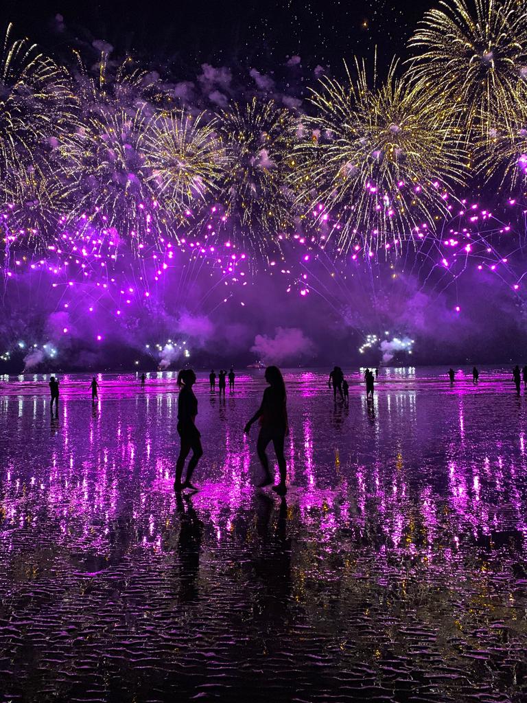 Lily North and Katrina Leembruggen enjoy the fireworks at Mindil Beach. Picture: Supplied