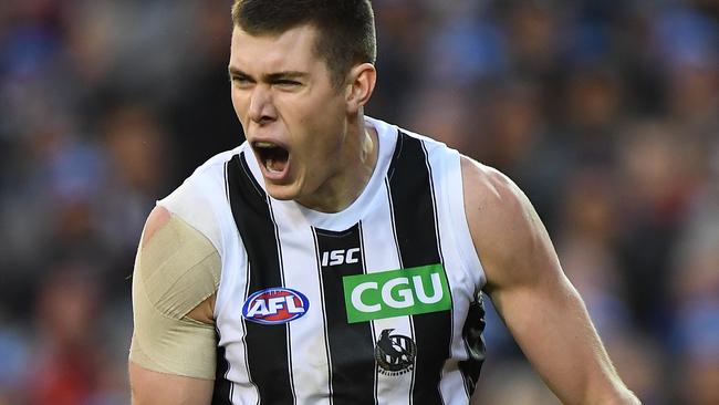 Mason Cox is hard to stop when he gets a run and jump at the footy.