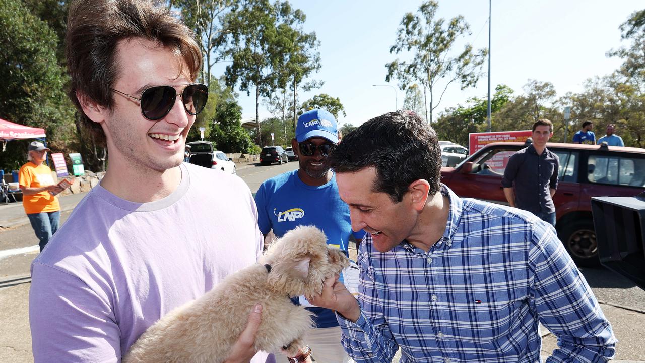 David Crisafulli finds a friendly face as he hands out how to vote cards in the seat of Gaven. Picture: Liam Kidston