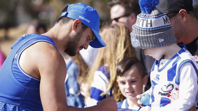 Hall takes some time out from training to sign autographs for fans. Picture: AAP