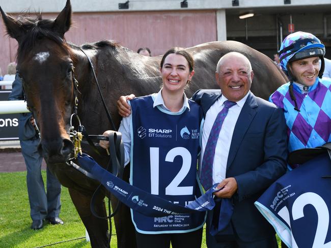 Owner Tony Ottobre (centre) with jockey Declan Bates (right) and strapper Samantha Waters following Pride of Jenni’s All-Star Mile success at Caulfield last Saturday. Picture: Vince Caligiuri / Getty Images