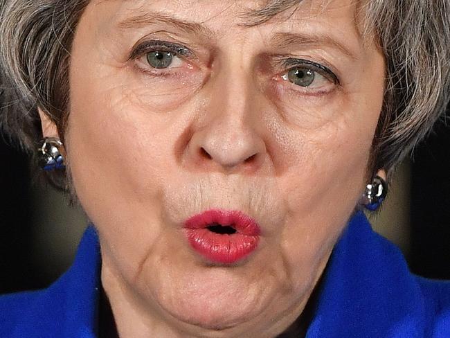 Britain's Prime Minister Theresa May delivers a statement to members of the media in Downing Street in London on January 16, 2019, after surviving a vote of no confidence in her government. - British Prime Minister Theresa May's government saw off a vote of no confidence in parliament on Wednesday, called after MPs overwhelmingly rejected the Brexit deal. (Photo by Ben STANSALL / AFP)