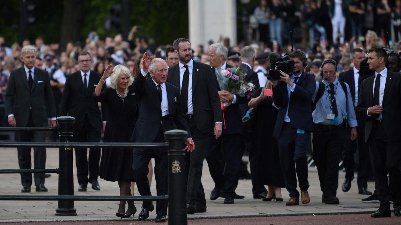 Britain's King Charles III and Camilla, Queen Consort greet the crowd at Buckingham Palace. Picture: AFP.