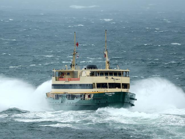 The “Freshwater” ferry heading out through the swell between the Heads on Wednesday. Supporters of the older ferries say they can cope much better with the big seas. Picture: Tim Hunter.