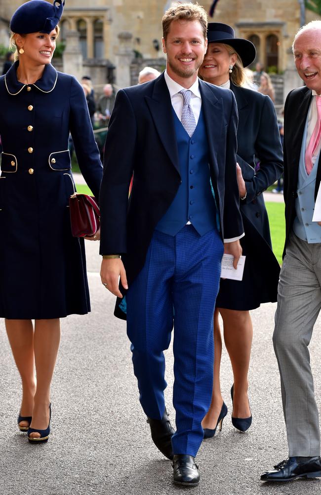 Isabella Calthorpe and Sam Branson arrive ahead of the wedding of Princess Eugenie of York to Jack Brooksbank at Windsor Castle on October 12, 2018 in Windsor, England. (Photo by Matt Crossick - WPA Pool/Getty Images)