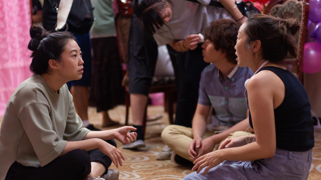 Awkwafina with writer/director Lulu Wang (right) during filming for The Farewell.