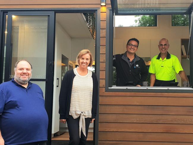 Waves of Kindness CEO Dan Riga inspect a tiny house with Youturn's Susan, Beaton, with Fabio Paulucci,  head of Aussie Tiny Houses and Pete Damiris from Waves of Kindness.