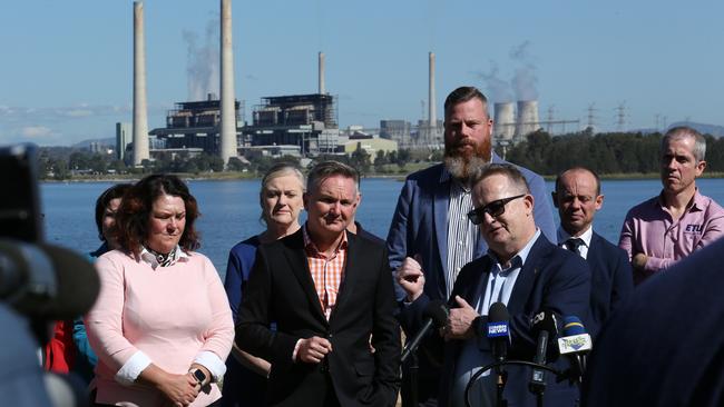 Energy Minister Chris Bowen holds a press conference at Lake Liddell recreation area, with view to Liddell power station, south of Muswellbrook in NSW, announcing Australia's Net Zero Authority. Britta Campion / The Australian