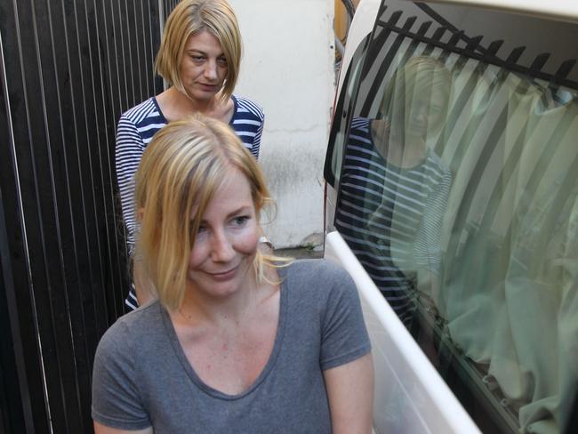 Australian TV presenter Tara Brown (back) and Sally Faulkner leaving prison. Picture: AFP.