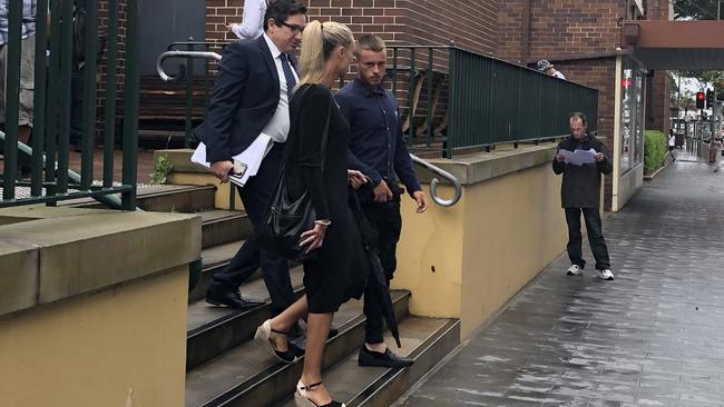 Kristian Iemma (blue shirt, centre) 19, of Cromer, outside Manly Court House where he appeared for allegedly holding a woman against her will after she got off a bus. Picture: Manly Daily