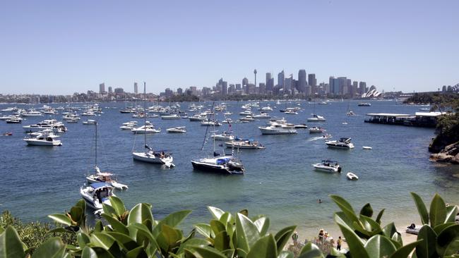 Boaties gather at Athol Bay, off Bradleys Head, for New Year’s Eve fireworks.