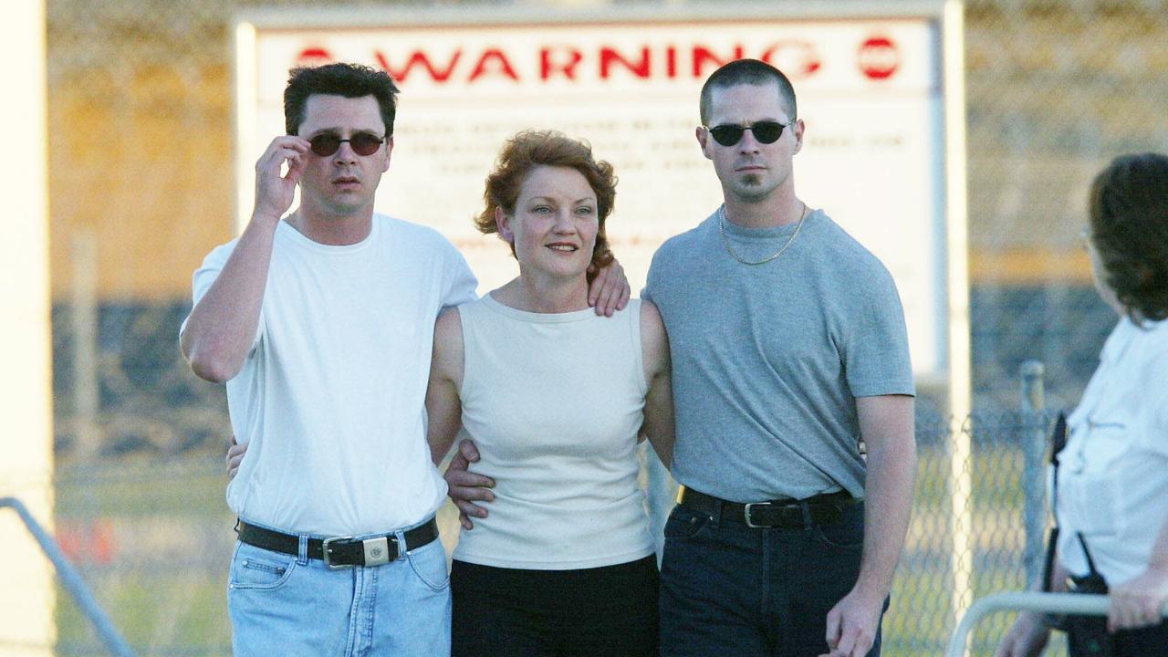 Pauline Hanson is embraced by sons Tony and Steven Zagorski after being released from prison in 2003.