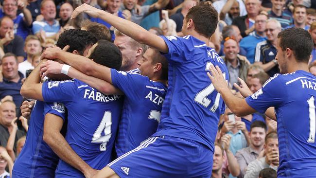 Chelsea's Diego Costa, left, celebrates his goal against Leicester City with teammates during their English Premier League soccer match at Stamford Bridge, London, Saturday, Aug. 23, 2014. (AP Photo/Sang Tan)