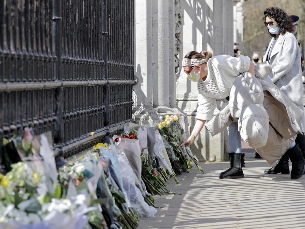 Members of the public lay floral tributes outside Buckingham Palace. Picture: Getty Images