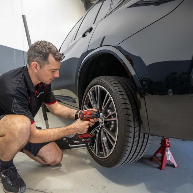 MagMedic’s Jordan Williams works his magic on an alloy wheel. Picture: Supplied.