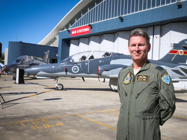 19/05/16 Terry Van Haren with the Hawk 127 that had clocked up over 100 000 flying hours. The Royal Australian Air Force has reached 100,000 hours of flight time on the Hawk 127 aircraft fleet. The Hawk 127 aircraft has been the premier lead in fighter trainer for the last 15 years, training a generation of fighter aircrew for conversion onto Air Combat GroupÕs front line fighter aircraft. Pic Renee Nowytarger / The Australian.