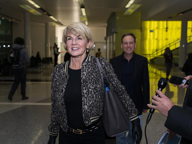 Foreign Minister Julie Bishop and Victorian MP Greg Hunt arrive at Canberra Airport on Sunday evening. Picture: Rohan Thomson