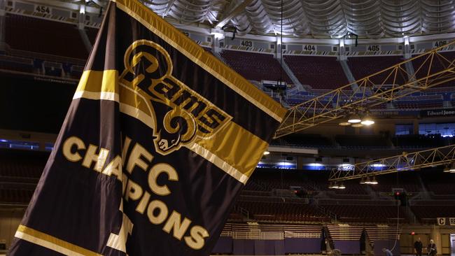 Rams championship banners are removed from the Edward Jones Dome, former home of the St. Louis Rams football team in St. Louis.
