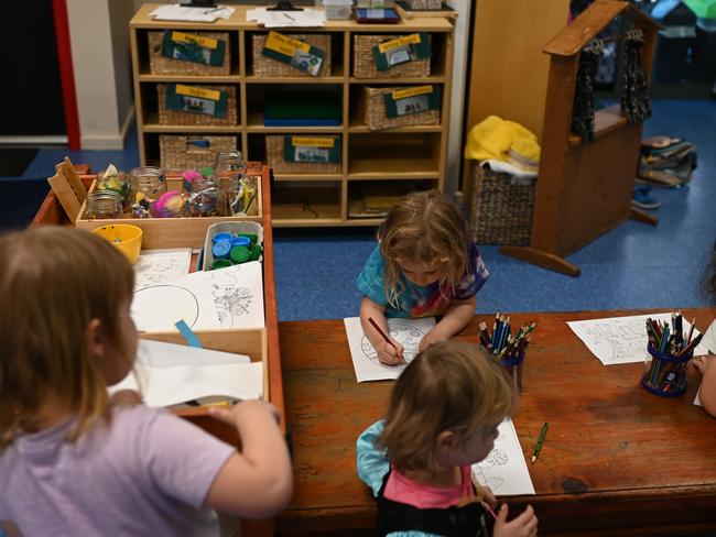 A small group of children play at the Robertson Street Kindy Childcare Centre in Helensburgh south of Sydney, Friday, April 3, 2020. The Federal Government announced that child care would be free for anyone who has a job and is still working during the COVID-19 Coronavirus crisis. (AAP Image/Dean Lewins) NO ARCHIVING