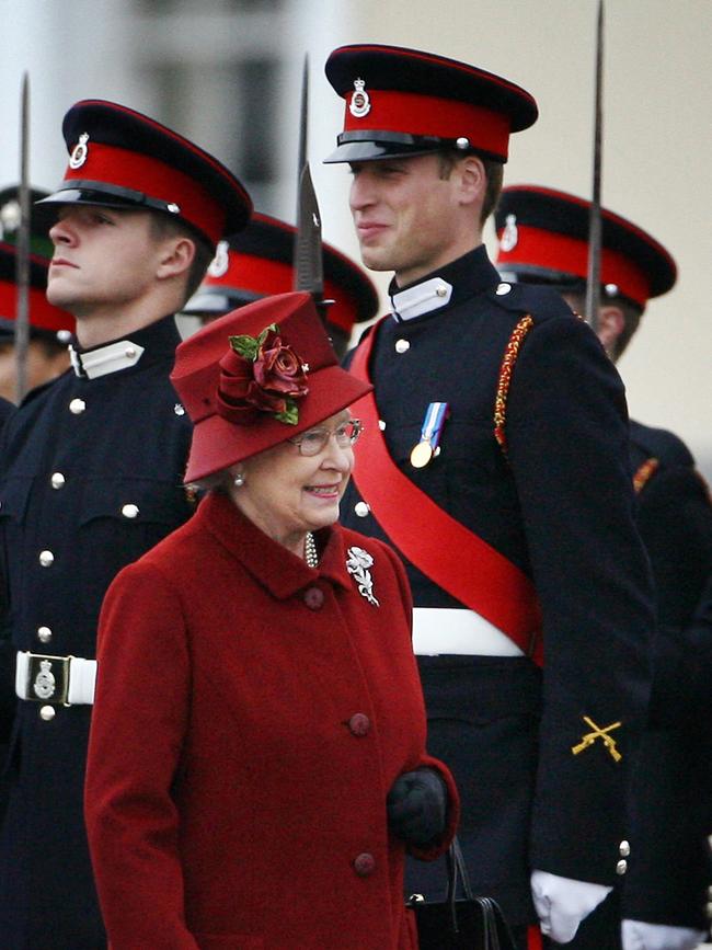 Prince William breaks into a smile as he is inspected by his grandmother Queen Elizabeth II, during the Sovereign's Parade at The Royal Military Academy in Camberley in 2006.