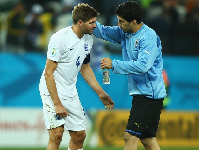 SAO PAULO, BRAZIL - JUNE 19: Luis Suarez of Uruguay consoles Steven Gerrard of England after Uruguay's 2-1 victory in the 2014 FIFA World Cup Brazil Group D match between Uruguay and England at Arena de Sao Paulo on June 19, 2014 in Sao Paulo, Brazil. (Photo by Clive Rose/Getty Images)