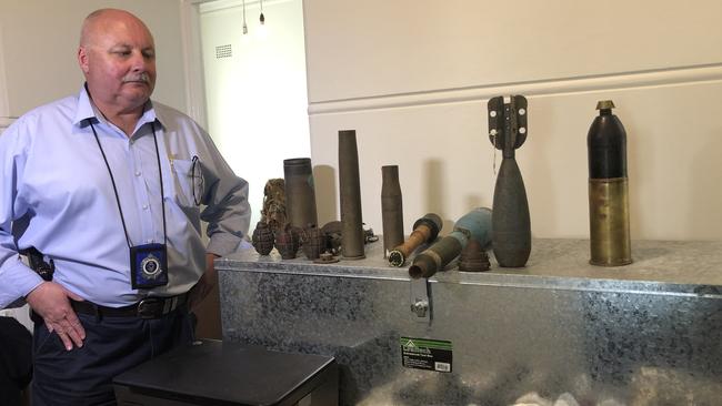 Lake Illawarra Licensing Sergeant Gary Keevers with some of the ammunition seized by the Australian Defence Force. Picture: Madeline Crittenden.