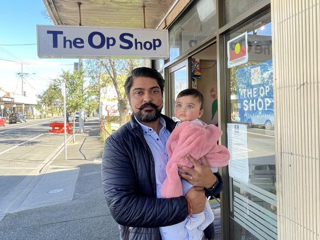 Pradeep Tiwari and his daughter outside the Op Shop which has been a target to many thefts and break ins.Picture: Athos Sirianos